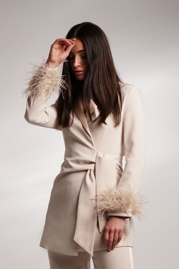 Beige jacket with feather sleeves
